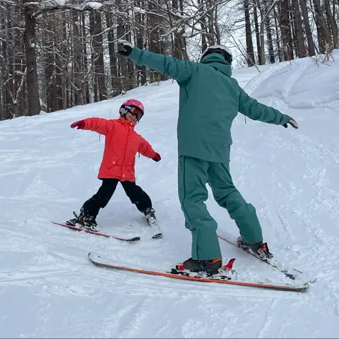 Beginner skier learning safely with a private instructor in Niseko