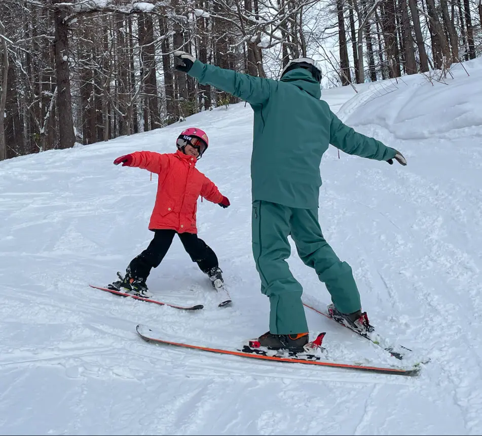 Beginner skier learning safely with a private instructor in Niseko